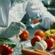 scientist meticulously examines fresh produce with magnifying glass highlighting precision care food safety quality control 720