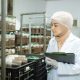 young asian muslim female scientist doing research mushroom factory examining mushroom 720