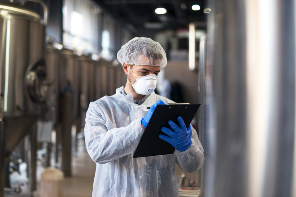HACCP auditors reviewing documentation and activities in factories